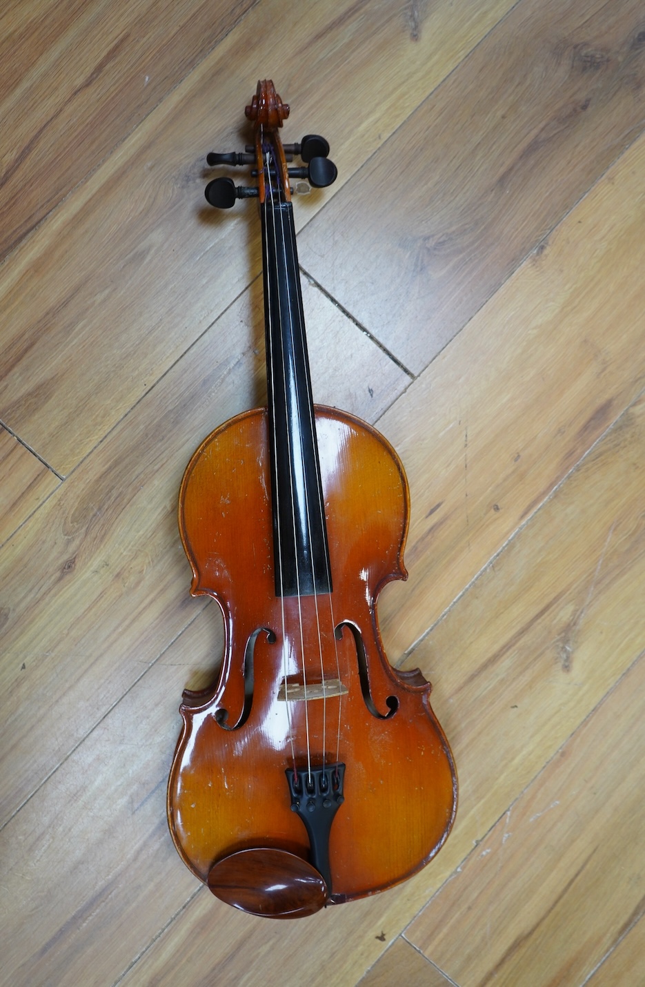 A cased Chinese viola, with makers label inside body which reads; ‘Made in Canton China’, body length 41cm. Condition fair to good.